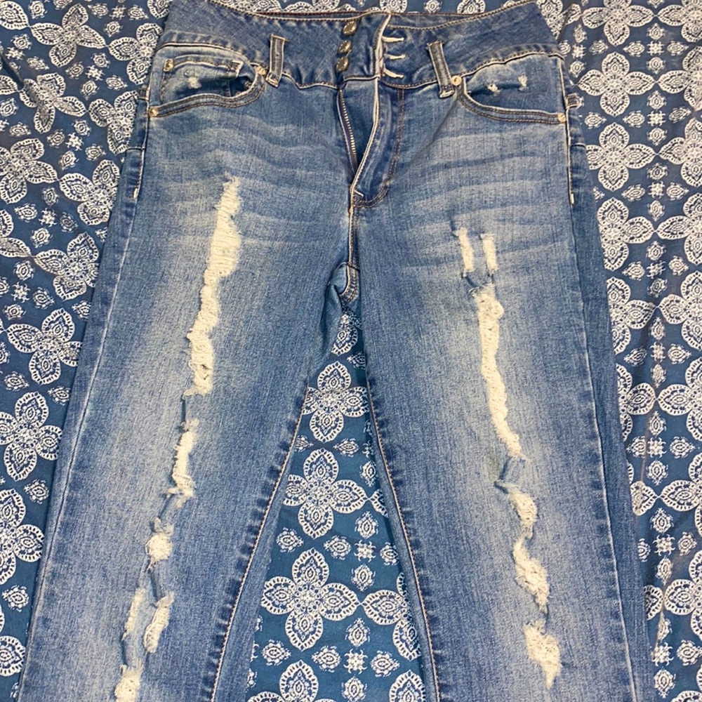Light blue ripped jeans